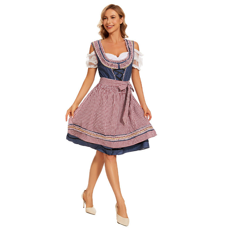 Damen nan traditionelles Trachtenkleid mit Schnürmieder, Spitzenärmeln und karierter Schürze Echo Archiv
