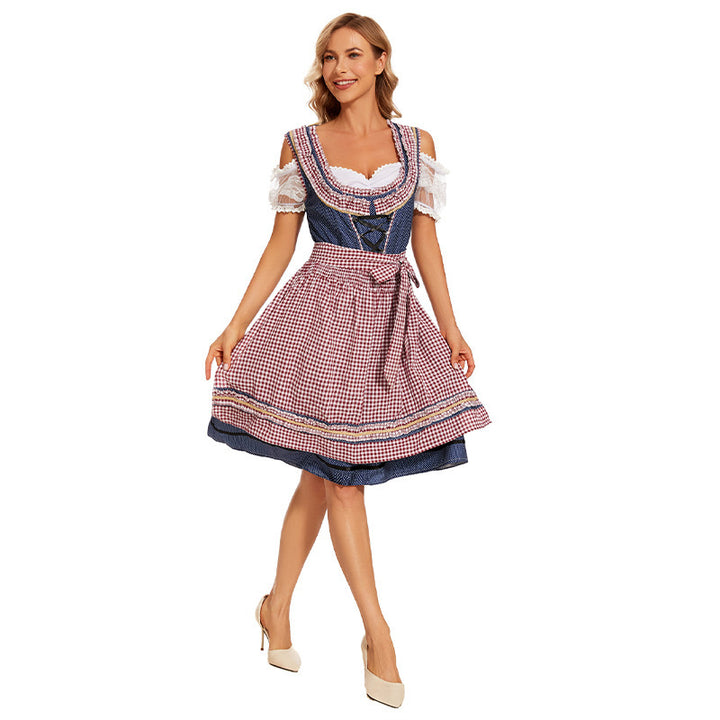 Damen nan traditionelles Trachtenkleid mit Schnürmieder, Spitzenärmeln und karierter Schürze Echo Archiv