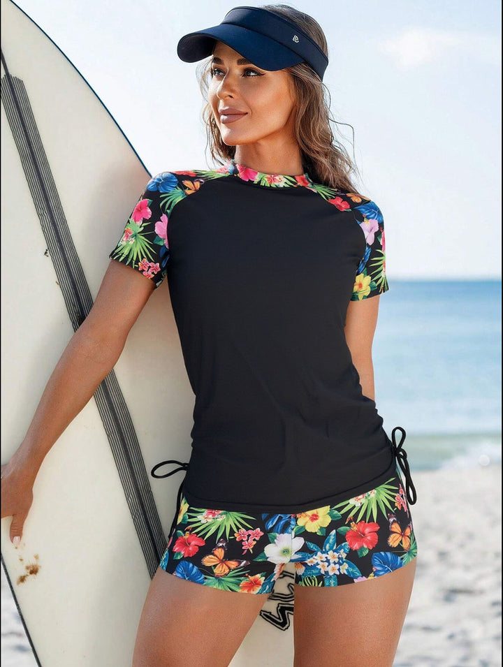 Damen Sportlicher Surfanzug mit floralem Muster und seitlichem Rüschendetail Echo Archiv