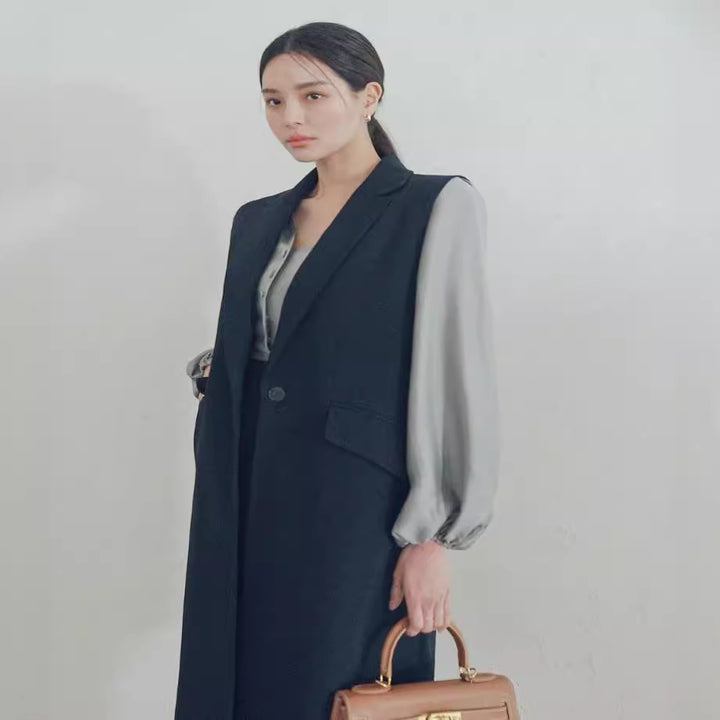 Damen Ärmellose Longweste im Tailoring mit Pattentaschen und einreihiger Knopfleiste Echoarchiv