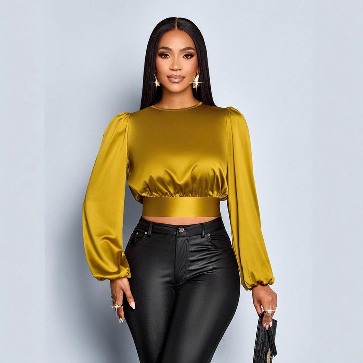 Damen Elegant geschnittene Leoparden-Bluse mit Dekolleté und Schleifenrand Echo Archiv