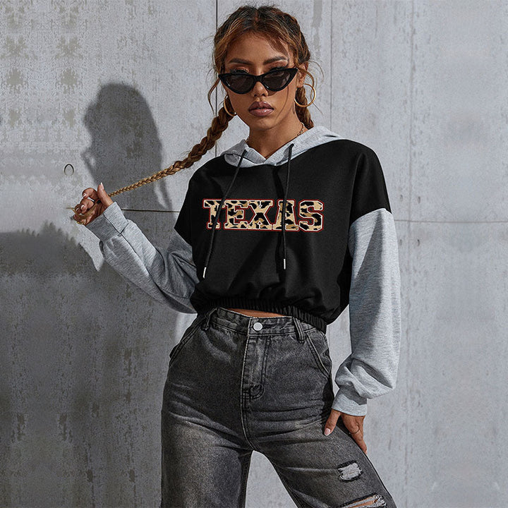 Damen Kurzgeschnittener Kapuzenpullover mit Teddy‑Print, Colorblock‑Ärmeln und elastischem Saum Echoarchiv
