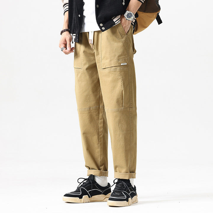 Herren Baggy-Utility-Cargohose im Tapered-Schnitt mit elastischem Tunnelzugbund, aufgesetzten Fronttaschen und Knieabnähern Echo Archiv