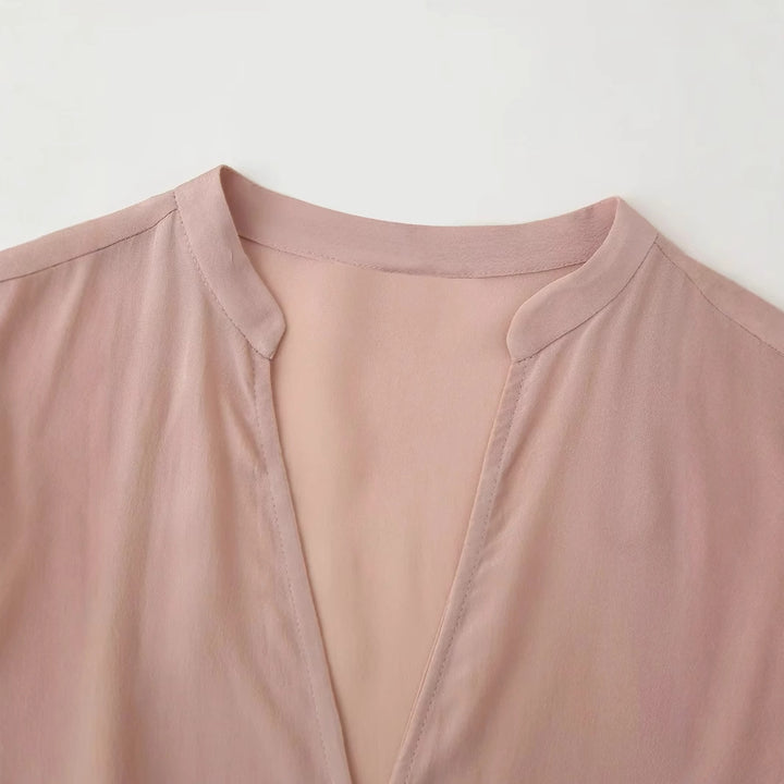 Damen nan elegante Bluse mit Perlenknopfleiste, Taillenzug und leichtem Schößchen Echo Archiv