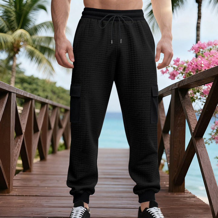 Herren Texturierte Cargo-Jogginghose mit Tunnelzug, aufgesetzten Klappentaschen und gerippten Bündchen – Bravaro