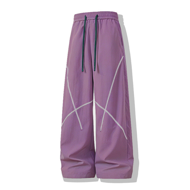 Herren Weite Funktions-Nylonhose mit Kordelbund, reflektierenden Nahtdetails & lässiger Baggy‑Silhouette Echoarchiv