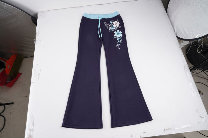 Damen Ausgestellte Lounge-Hose mit Rippbund, Kordelzug und floralem Print – Avélisse