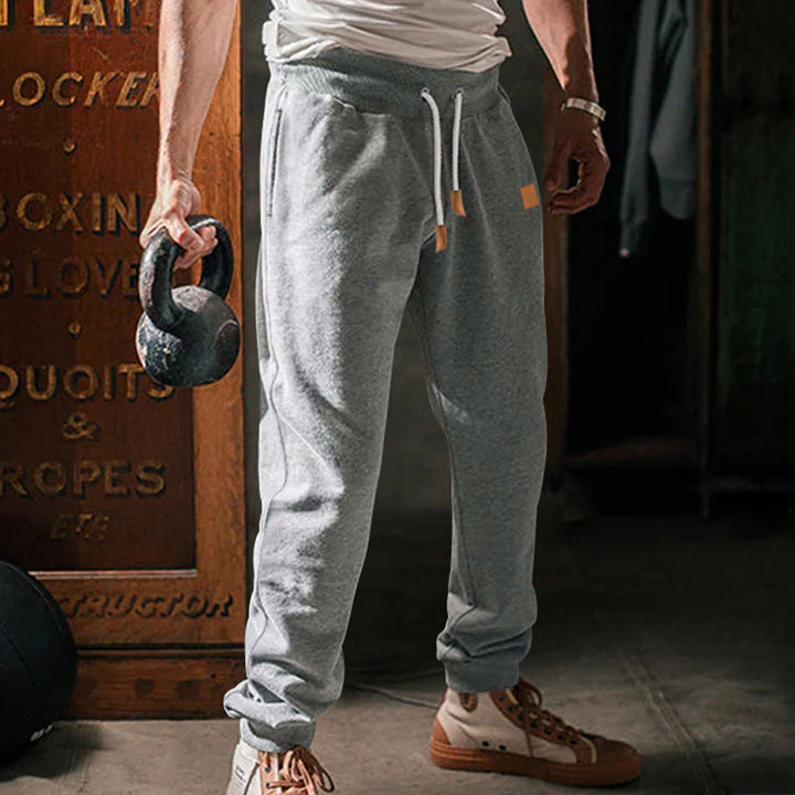 Herren Slim-Fit Jogginghose mit elastischem Bund, Kordelzug und schmalem Beinabschluss Echoarchiv