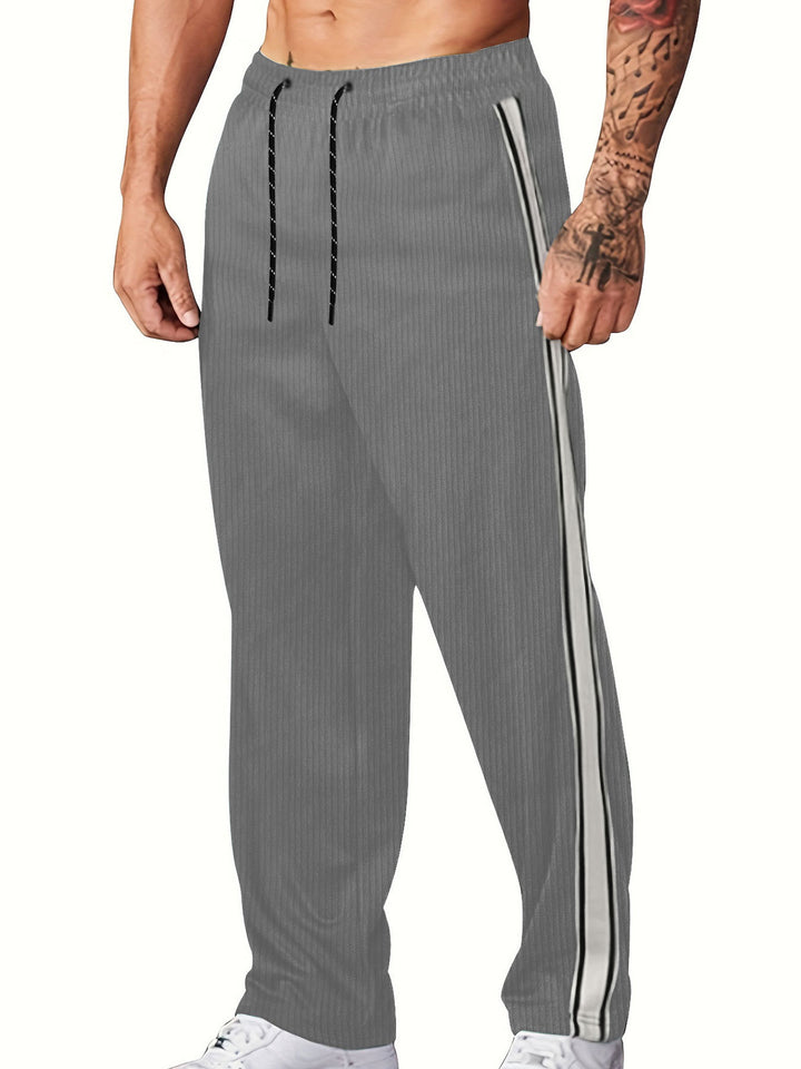 Herren nan gerippte Relax-Jogginghose mit weitem Bein, seitlicher Paspel und elastischem Kordelbund Echo Archiv