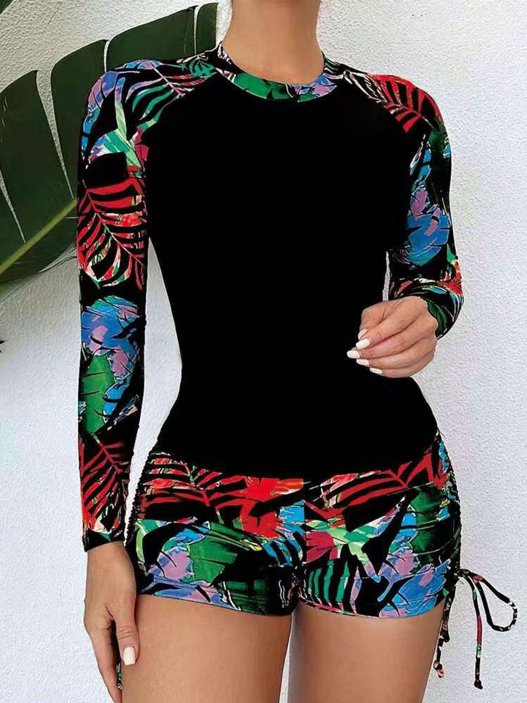 Damen Sport-Rashguard mit kurzen Hosen und farbenfrohem Muster Echo Archiv
