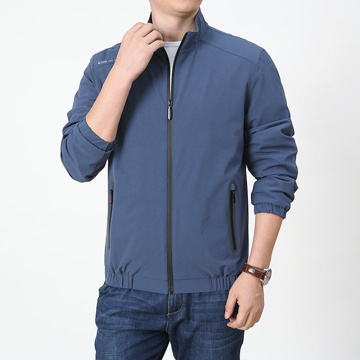 Herren Leichte Softshell-Windjacke mit Stehkragen wasserabweisenden Reißverschlüssen und Mesh-Innenfutter – Taviero