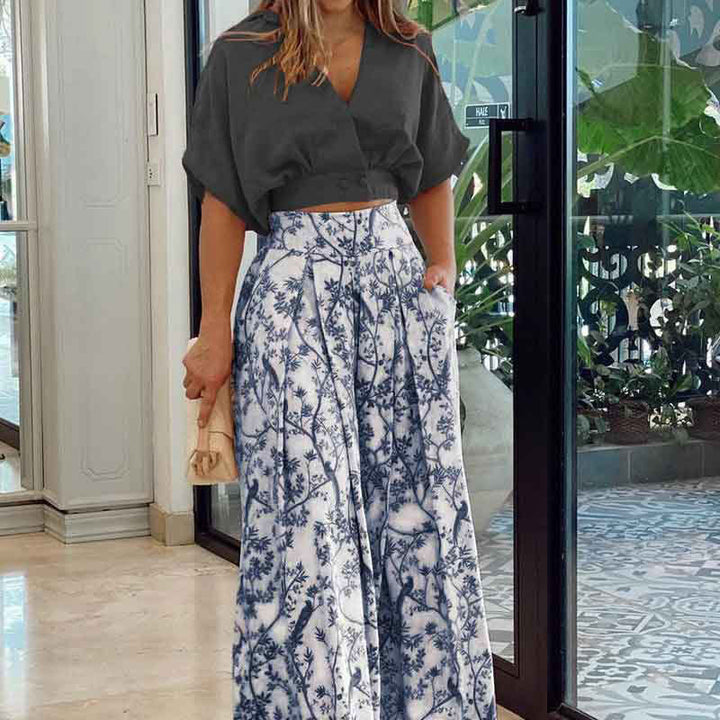 Damen Crop-Top Kombi-Anzug mit Weitem Rock und Floralem Muster Echoarchiv