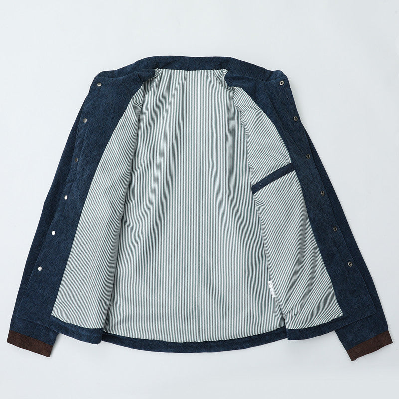 Herren Steppjacke im Cord-Mix mit Kontrast-Schulterpartie und verdeckter Druckknopfleiste Echoarchiv