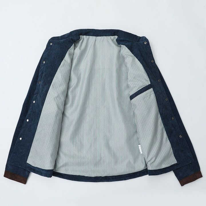 Herren Steppjacke im Cord-Mix mit Kontrast-Schulterpartie und verdeckter Druckknopfleiste Echoarchiv