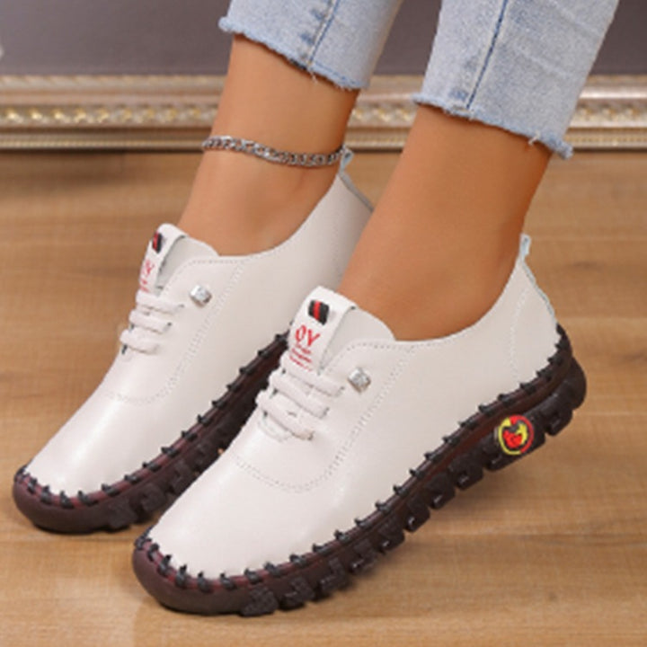 Damen Leichter, weicher Slipper mit handgenähter Gummisohle und elastischer Schnürung Echo Archiv