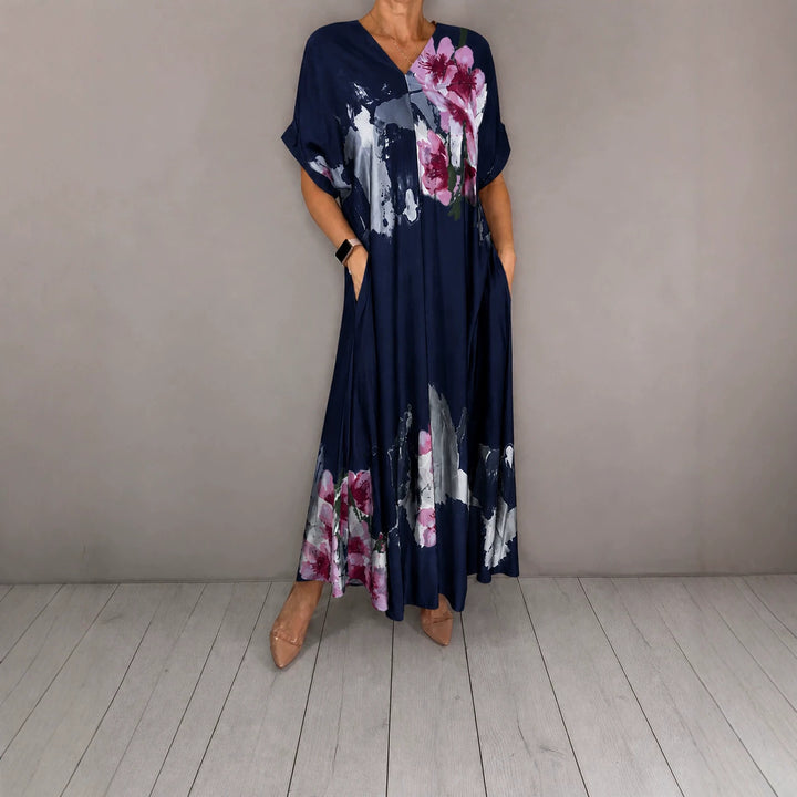 Damen Maxikleid mit weitem Fall, V-Ausschnitt, Eingrifftaschen und floraler Aquarelloptik Echoarchiv