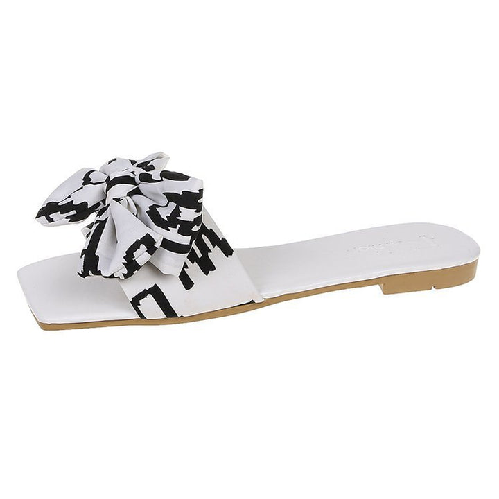 Damen Flache Riemen-Slides mit großem Stoffknoten und quadratischer Zehenpartie – Sorelia
