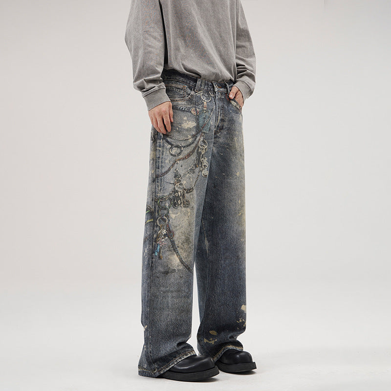 Herren Weit geschnittene Stonewashed-Denim-Jeans mit Kettenprint, Farb‑Splatter und bodenlangem Saum Echo Archiv