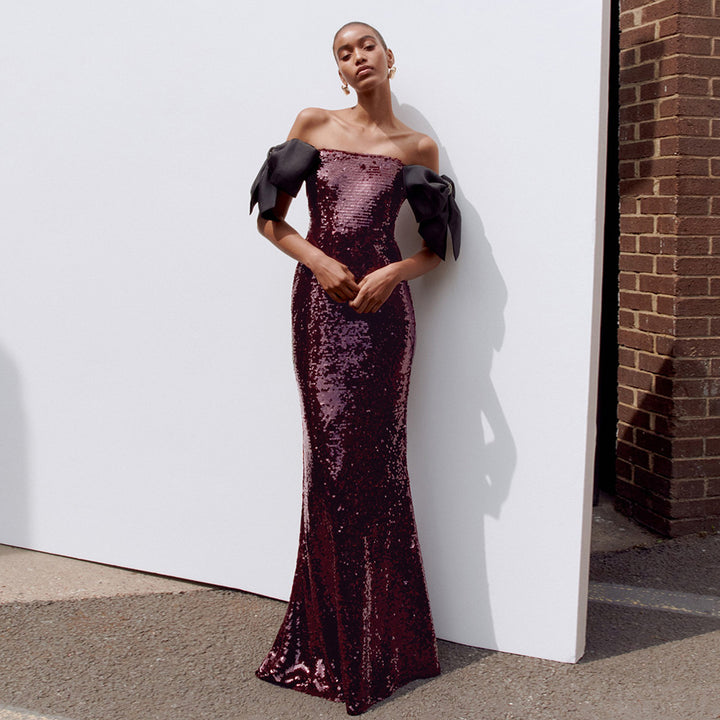 Damen Elegantes Pailletten-Maxikleid mit schulterfreiem Design und dekorativen Schleifen Echo Archiv