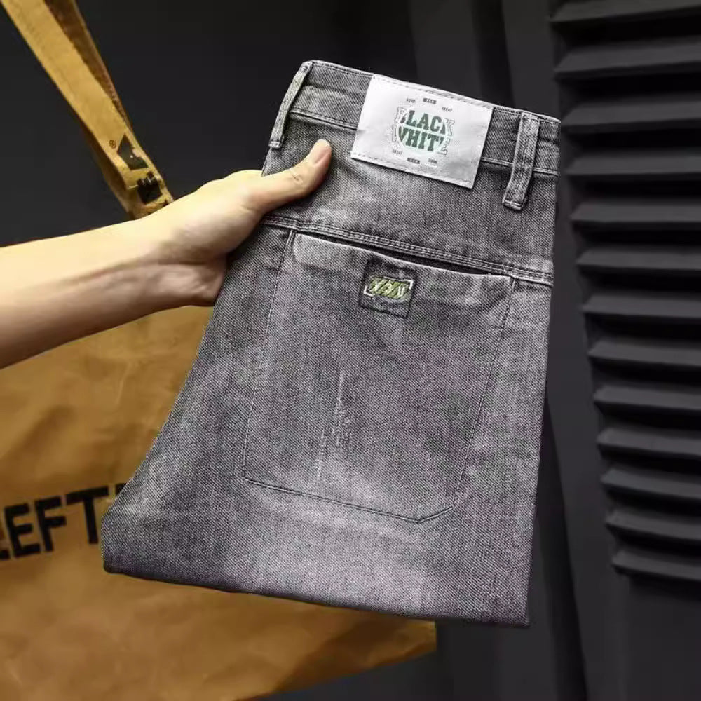 Herren lässige Jeans mit modernen Used-Effekten und konisch zulaufendem Bein Echoarchiv