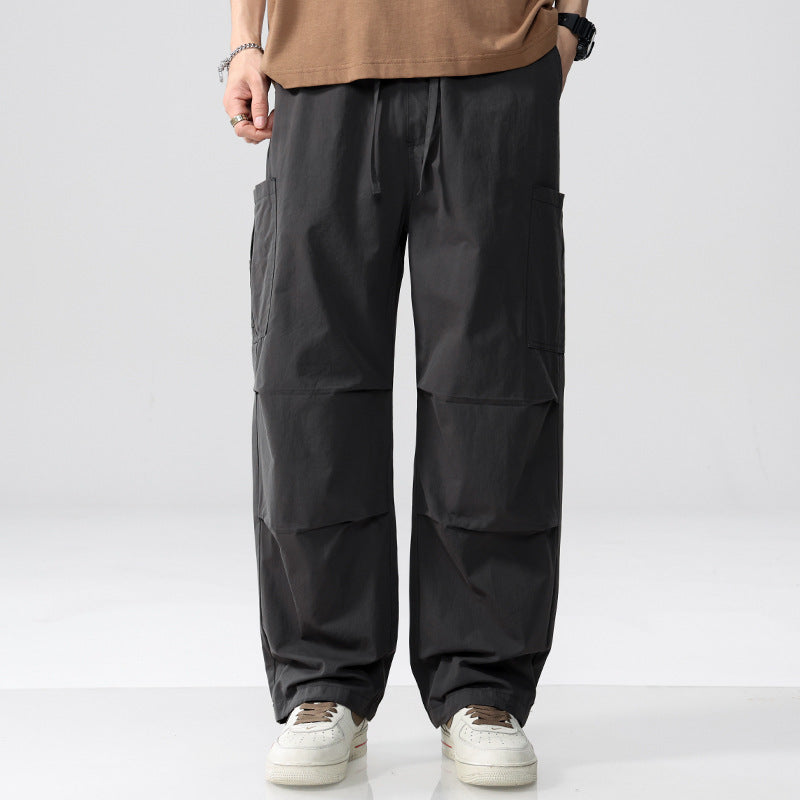 Herren Weite Cargohose im Utility‑Stil mit Kordelzug und aufgesetzten Beintaschen Echoarchiv