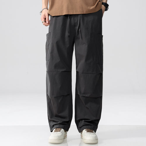 Herren Weite Cargohose im Utility‑Stil mit Kordelzug und aufgesetzten Beintaschen Echoarchiv