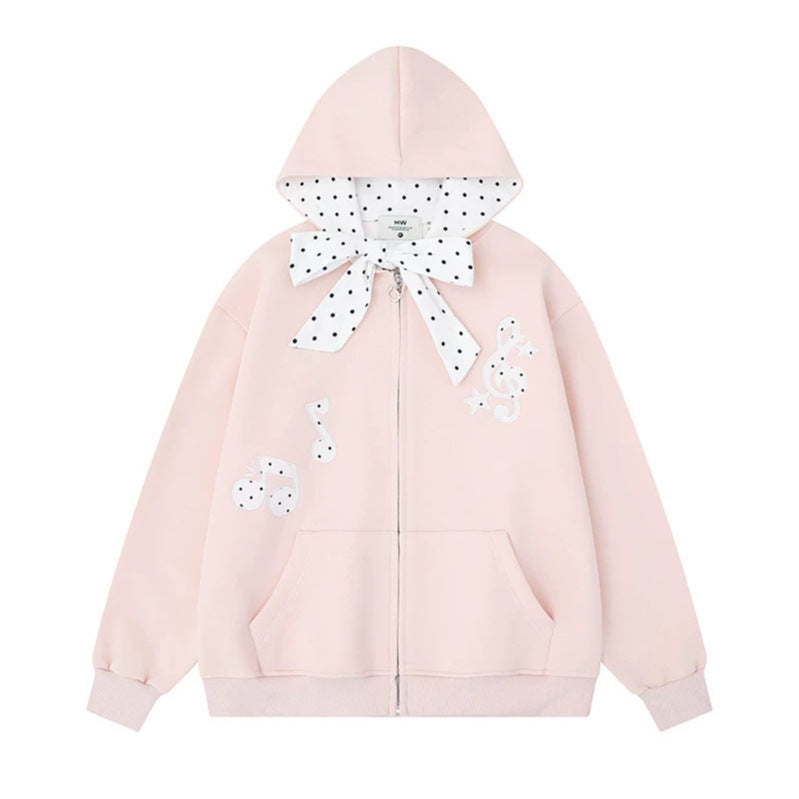 Damen Kapuzensweatjacke mit gepünktetem Kapuzenfutter, dekorativer Schleife und Notenmotiv Echoarchiv