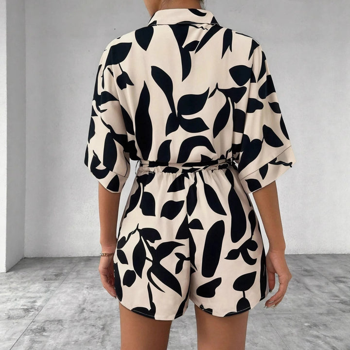 Damen Kurzärmliger Jumpsuit mit floralem Print und Taillengürtel Echo Archiv