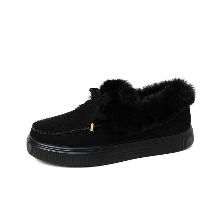Damen Kuschel‑Mokassin‑Slipper mit hochfloriger Fellmanschette, dekorativer Steppnaht und leichtem Plateau‑Sohlenprofil Echo Archiv