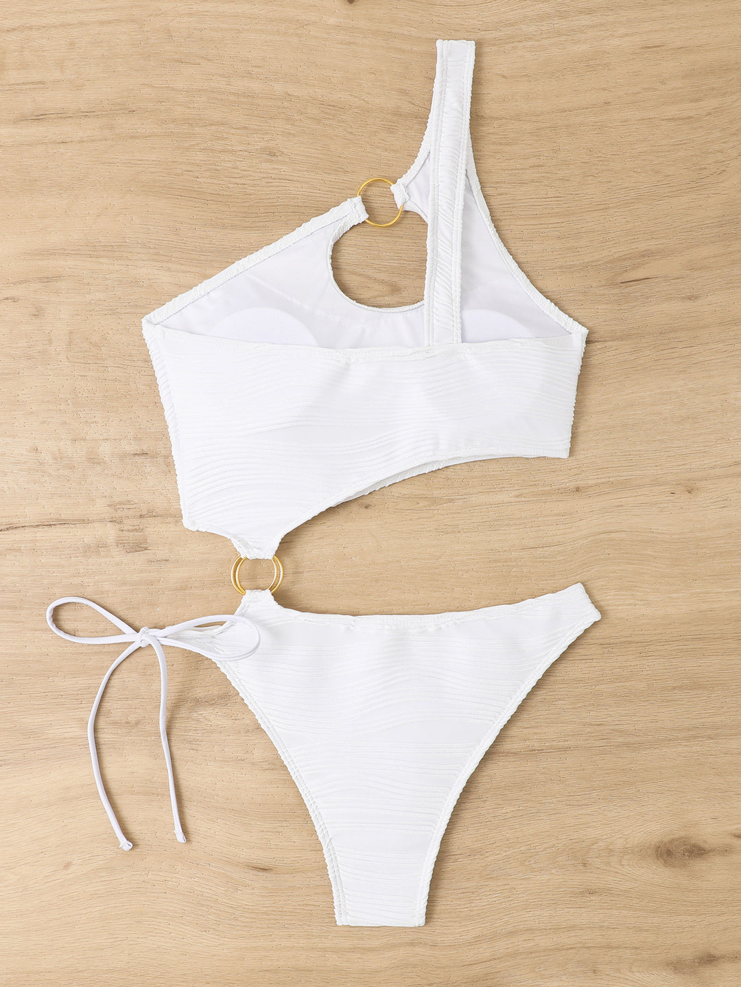 Damen Einteiler Badeanzug mit asymmetrischem Cut-Out und goldenen Akzenten Echo Archiv