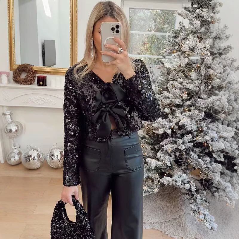 Damen Kurzjacke mit Paillettenbesatz und Zierschleifen-Front Echo Archiv