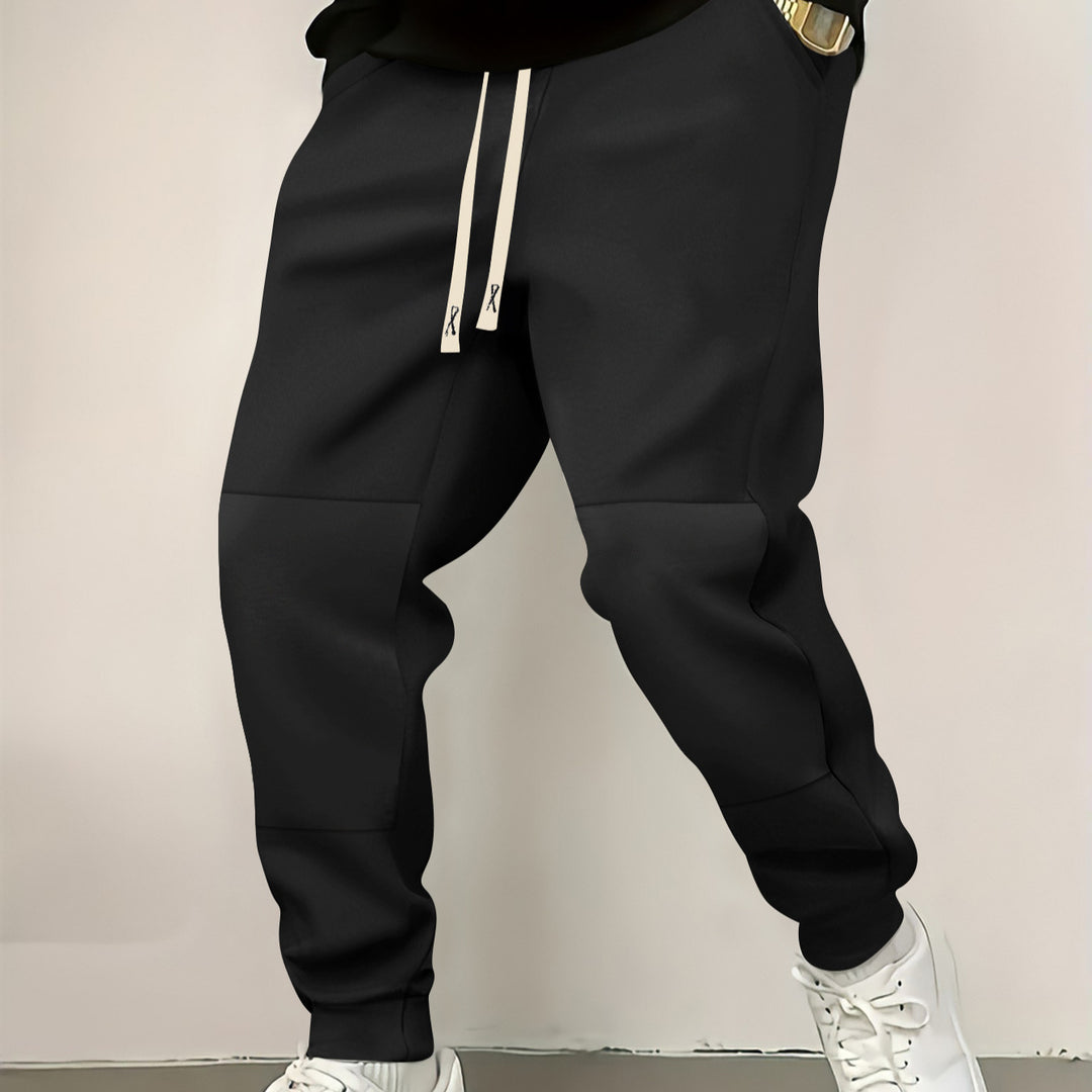 Herren elegante Sporthose mit modernen Farbblockelementen Echoarchiv