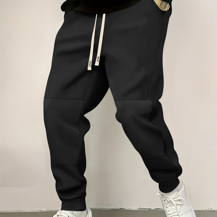 Herren elegante Sporthose mit modernen Farbblockelementen Echoarchiv