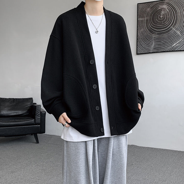Herren nan oversized Strickcardigan mit V-Ausschnitt, aufgesetzten Rundtaschen und lässiger Drop-Shoulder-Silhouette Echo Archiv