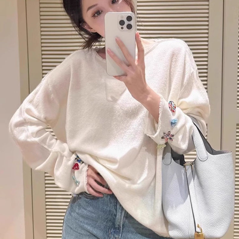 Damen Oversize-Feinstrickpullover mit schmuckbesetzten Ärmelabschlüssen Echoarchiv
