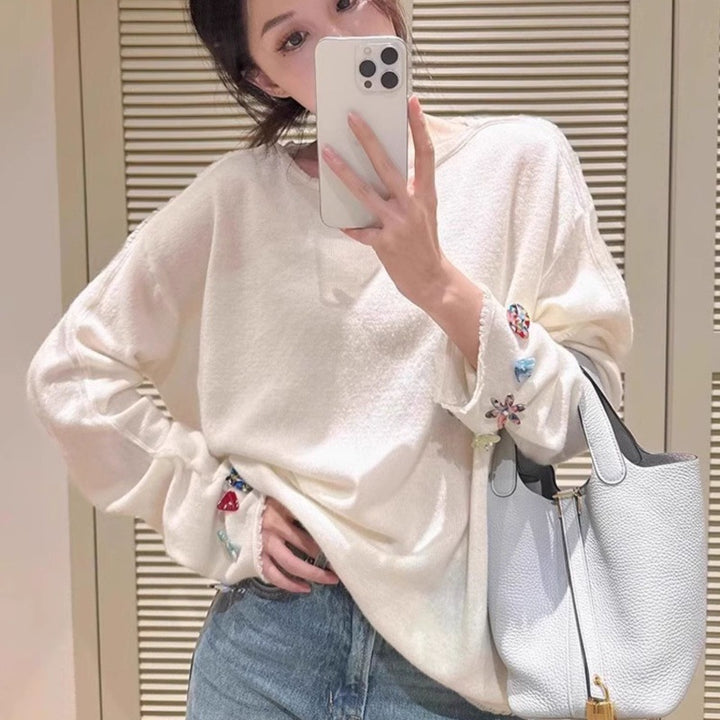 Damen Oversize-Feinstrickpullover mit schmuckbesetzten Ärmelabschlüssen Echoarchiv