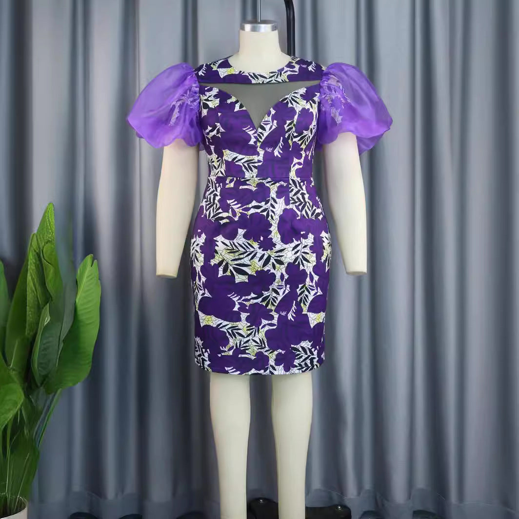 Damen extravagantes Cocktailkleid mit voluminösen Puffärmeln und floralem Muster Echo Archiv