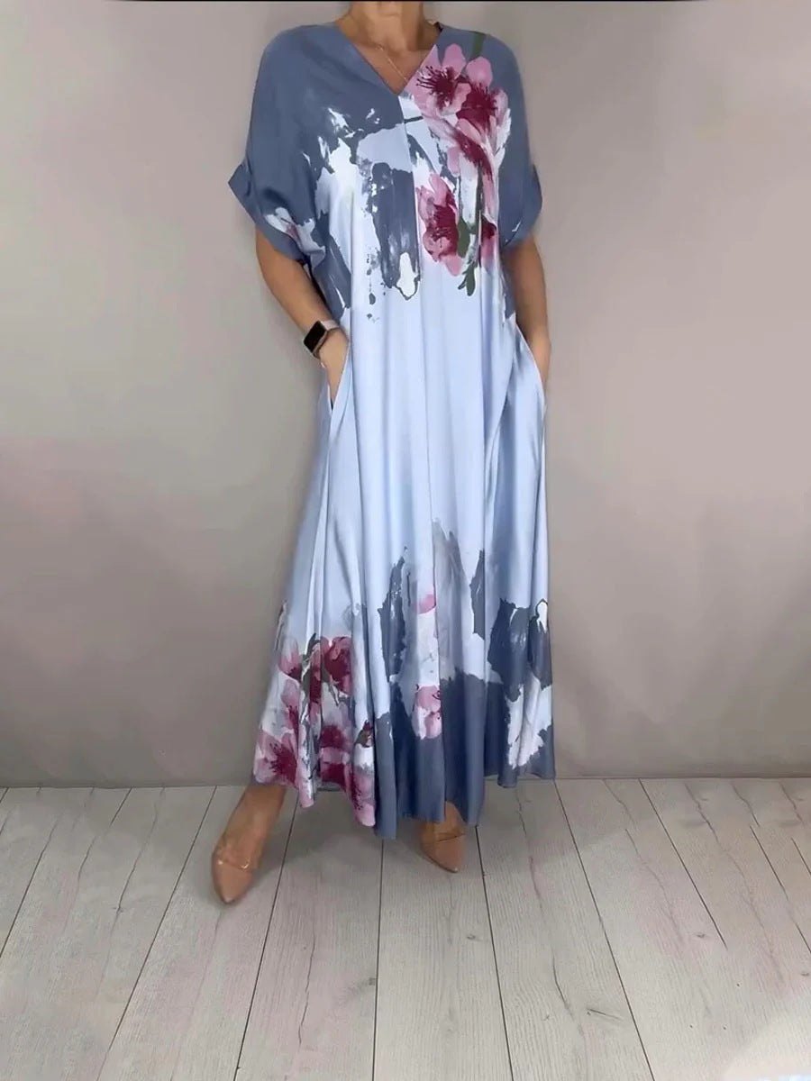 Damen Maxikleid mit weitem Fall, V-Ausschnitt, Eingrifftaschen und floraler Aquarelloptik Echoarchiv