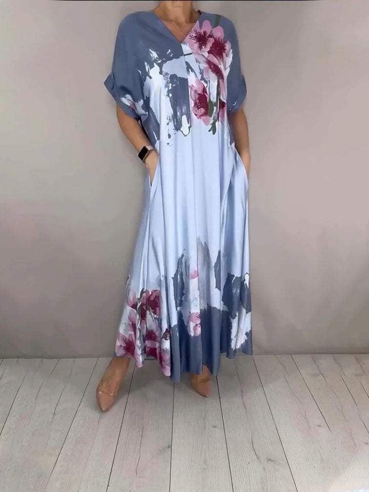 Damen Maxikleid mit weitem Fall, V-Ausschnitt, Eingrifftaschen und floraler Aquarelloptik Echoarchiv