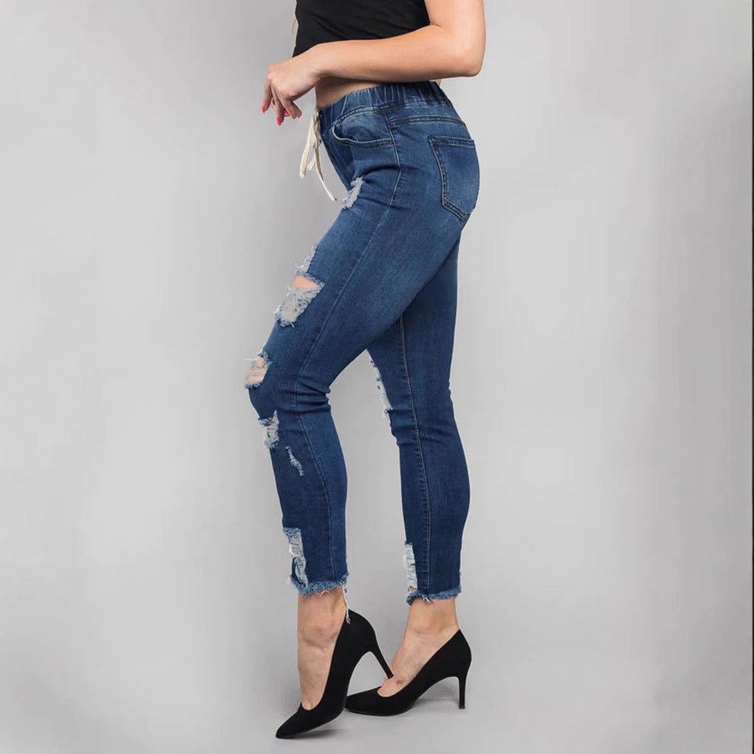 Damen Hochtaillierte Destroyed-Jogger-Jeans mit elastischem Tunnelzugbund und gekürztem Fransen-Saum Echo Archiv