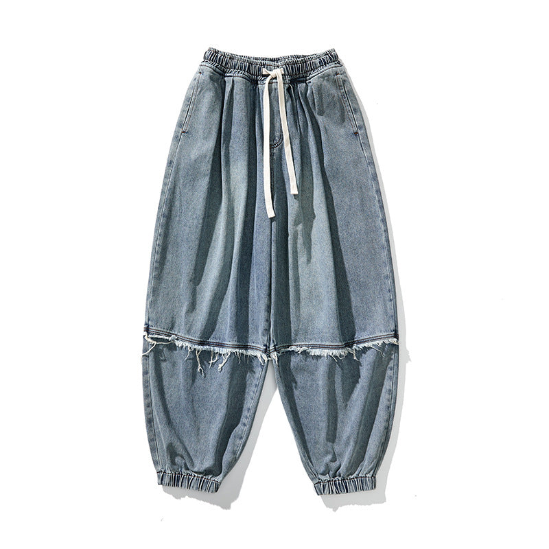 Herren Weit geschnittene Baggy-Denim-Hose mit Tunnelzug, elastischen Beinabschlüssen und Fransen-Detail Echo Archiv