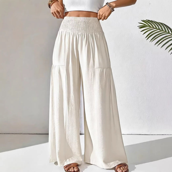 Damen weite Palazzo-Hose mit gerafftem Smock-Bund und Stufendetails – Avélisse
