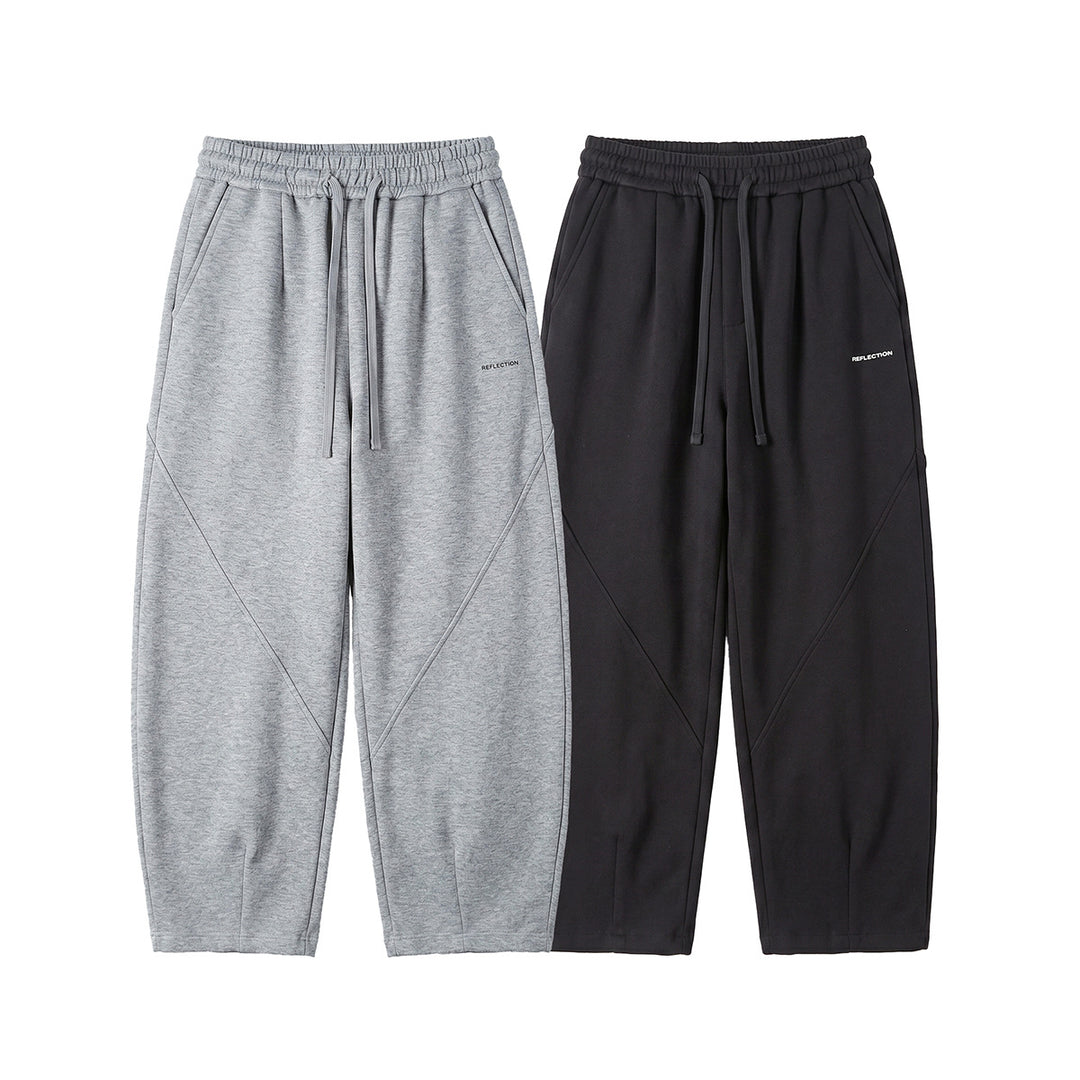Herren Locker geschnittene Jogginghose mit Tunnelzug, Zierrnähten und Eingrifftaschen Echoarchiv