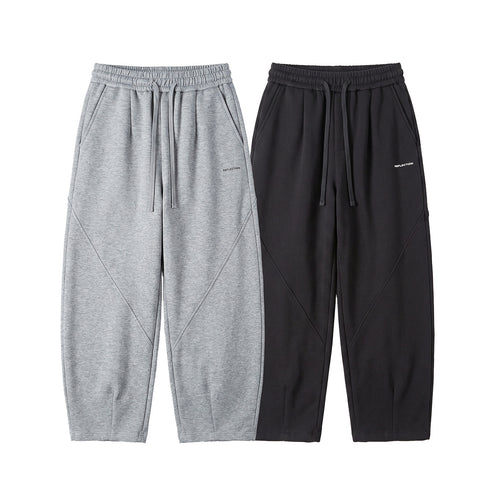 Herren Locker geschnittene Jogginghose mit Tunnelzug, Zierrnähten und Eingrifftaschen Echoarchiv