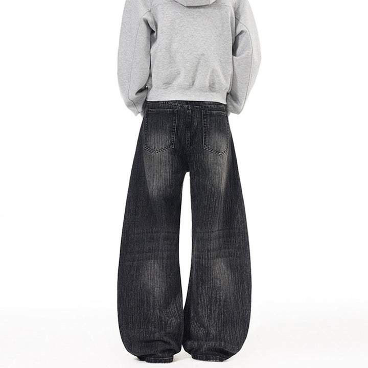 Herren Weite Vintage-inspirierte Denim‑Palazzohose mit verlängerter Saumlage und soften Bleach‑Effekten Echo Archiv