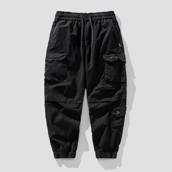 Herren Leichte Canvas-Cargohose im Joggerstil mit elastischem Bund, segmentierten Kniepaneelen und verdeckten Klappentaschen Echo Archiv