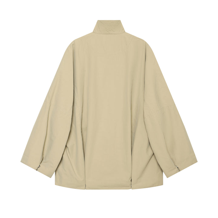 Damen kurzer wasserabweisender Cape-Mantel mit Stehkragen und Druckknopfverschluss – Célinea