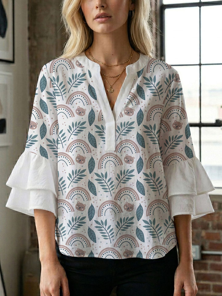 Damen Bluse mit voluminösen Flügelärmel und intensivem Blattmuster Echo Archiv
