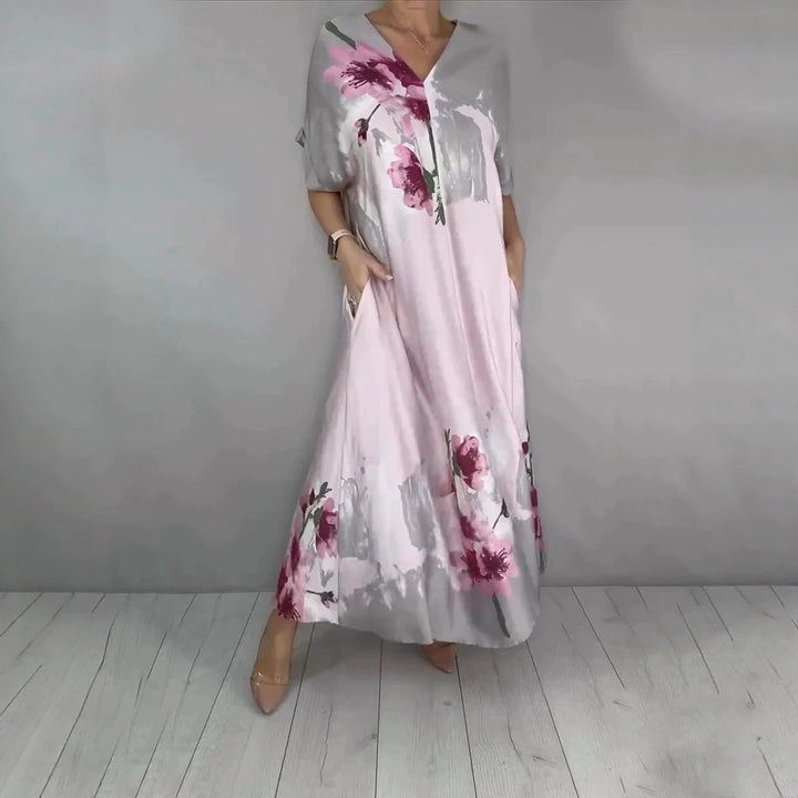 Damen Maxikleid mit weitem Fall, V-Ausschnitt, Eingrifftaschen und floraler Aquarelloptik Echoarchiv