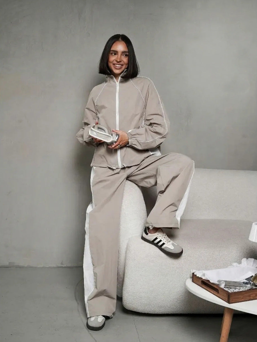 Damen sportlich-elegantes Trackset mit Stehkragen, Reißverschlussjacke und weitem Seitenstreifen-Hose – Avérine